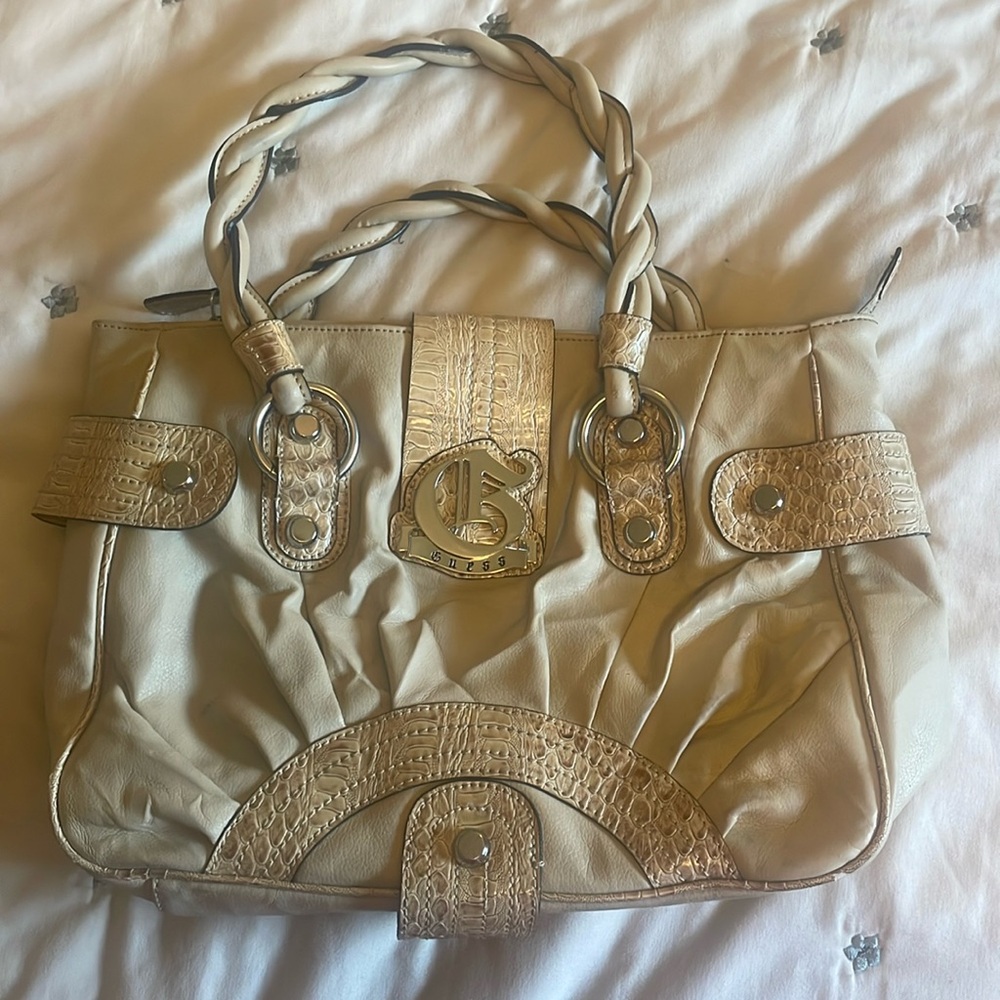Guess handbag,cream base color,light brown snake print detail,13 1/2 W, 10 H,5 D